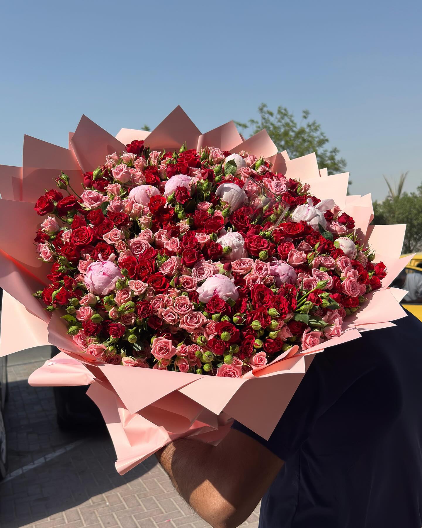 100 pink and red baby roses with peonies luxury mixed bouquet same-day delivery Dubai Flowerdxb