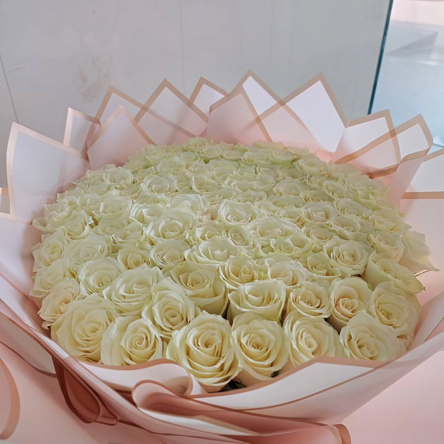100 fresh white roses luxury pink wrapping bouquet same-day delivery Dubai AED 335 Flowerdxb