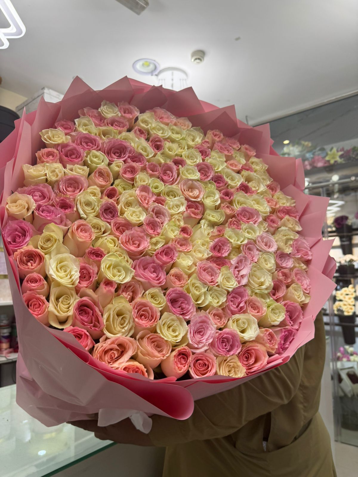 200 pink and white roses in pink wrapping for anniversary or proposal, same-day delivery Dubai Sharjah