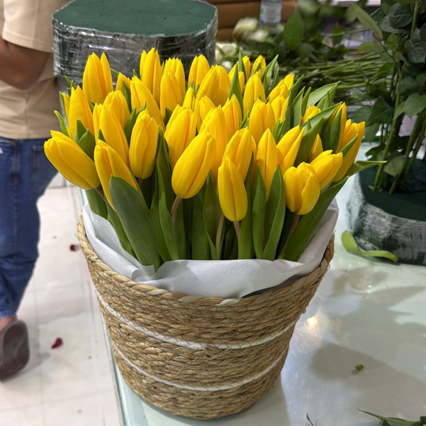 Close-up of vibrant yellow tulip blooms in a luxury gift basket, Flowerdxb Dubai delivery