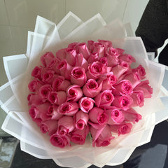 50 fresh pink roses classic white wrapping same-day flower delivery Dubai AED 230 Flowerdxb
