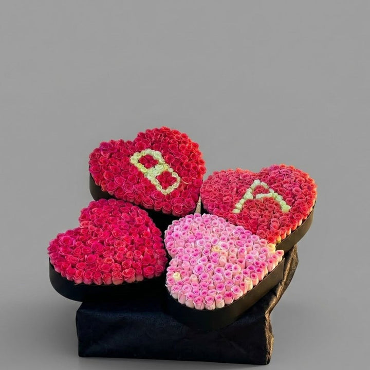 100 Roses  4 Heart-Shaped Boxes with Custom Letters | Ultimate Valentine's Gift Dubai